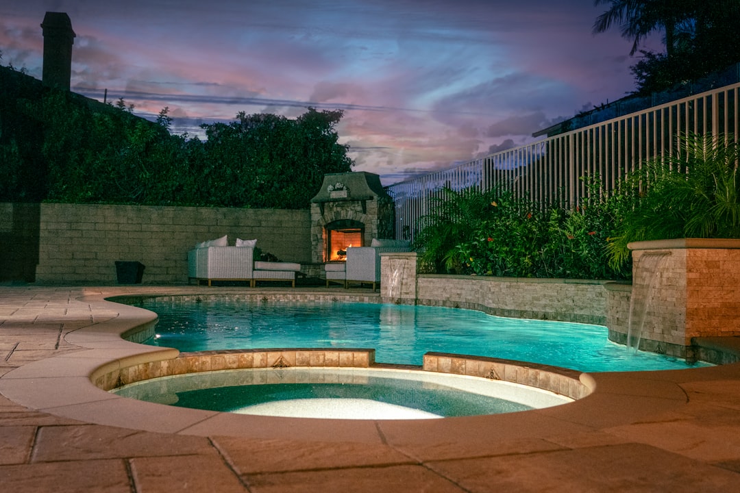 Beautiful swimming pool with building in background